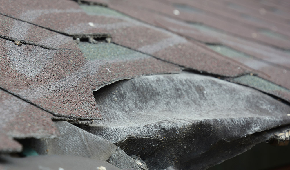 Damage roof shingles