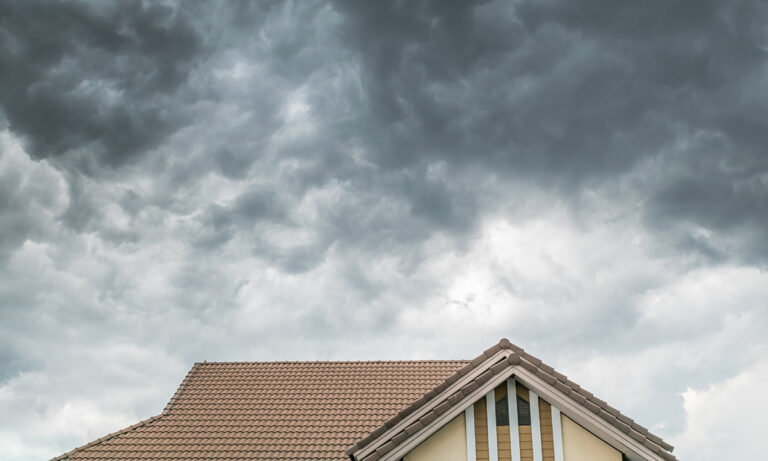 Dark cloud over the house roof during Hurricane season