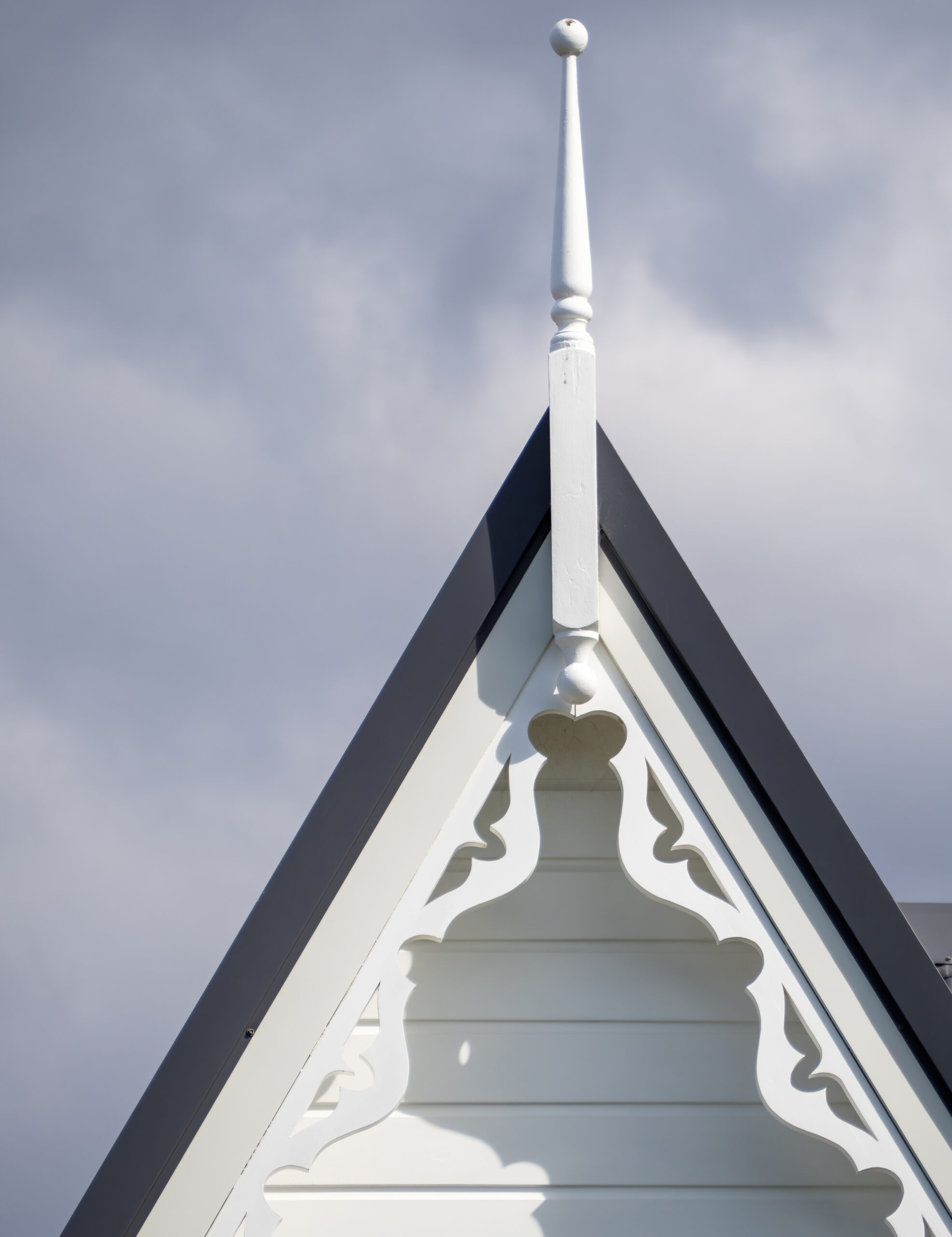 Gable roof with finial and carved fascia