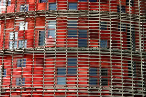 Rain screens as part of fenestration system of an office building