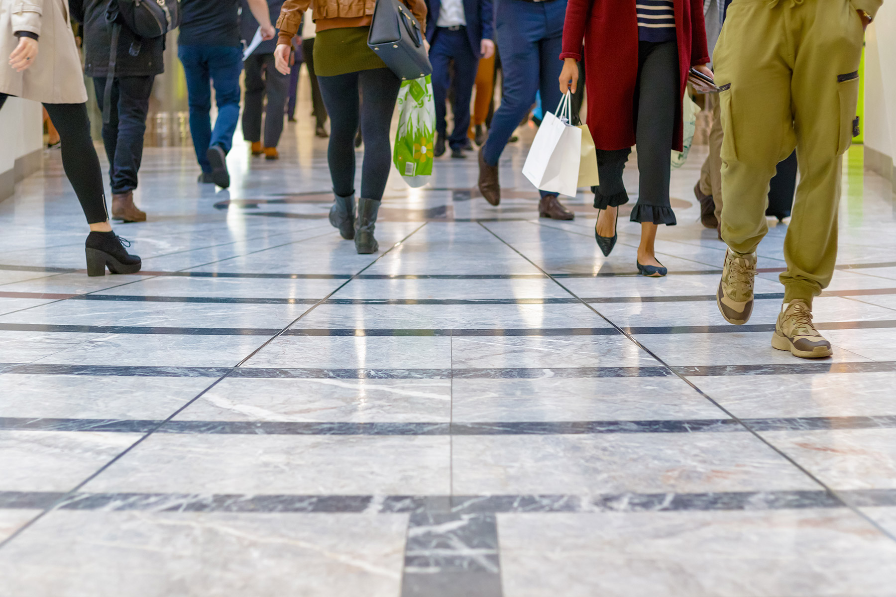 crowd walking on tile floor