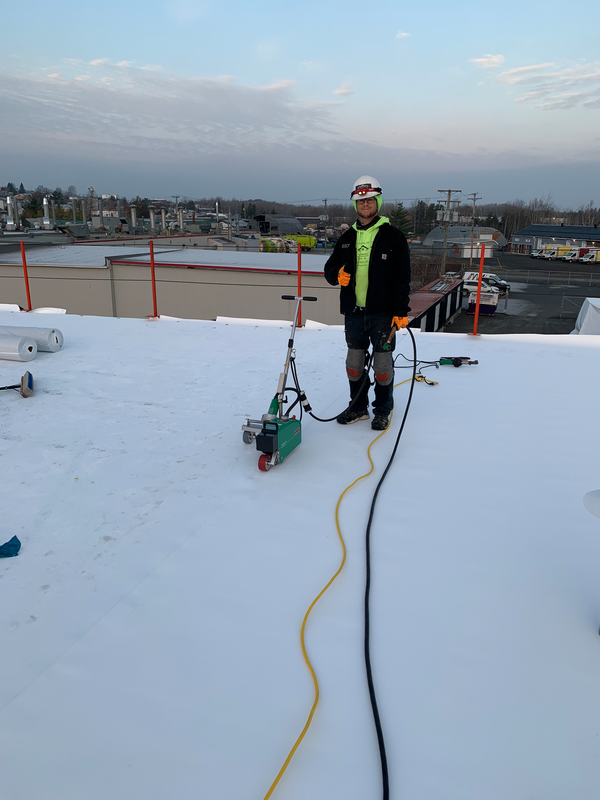 A contractor working on comercial roofs