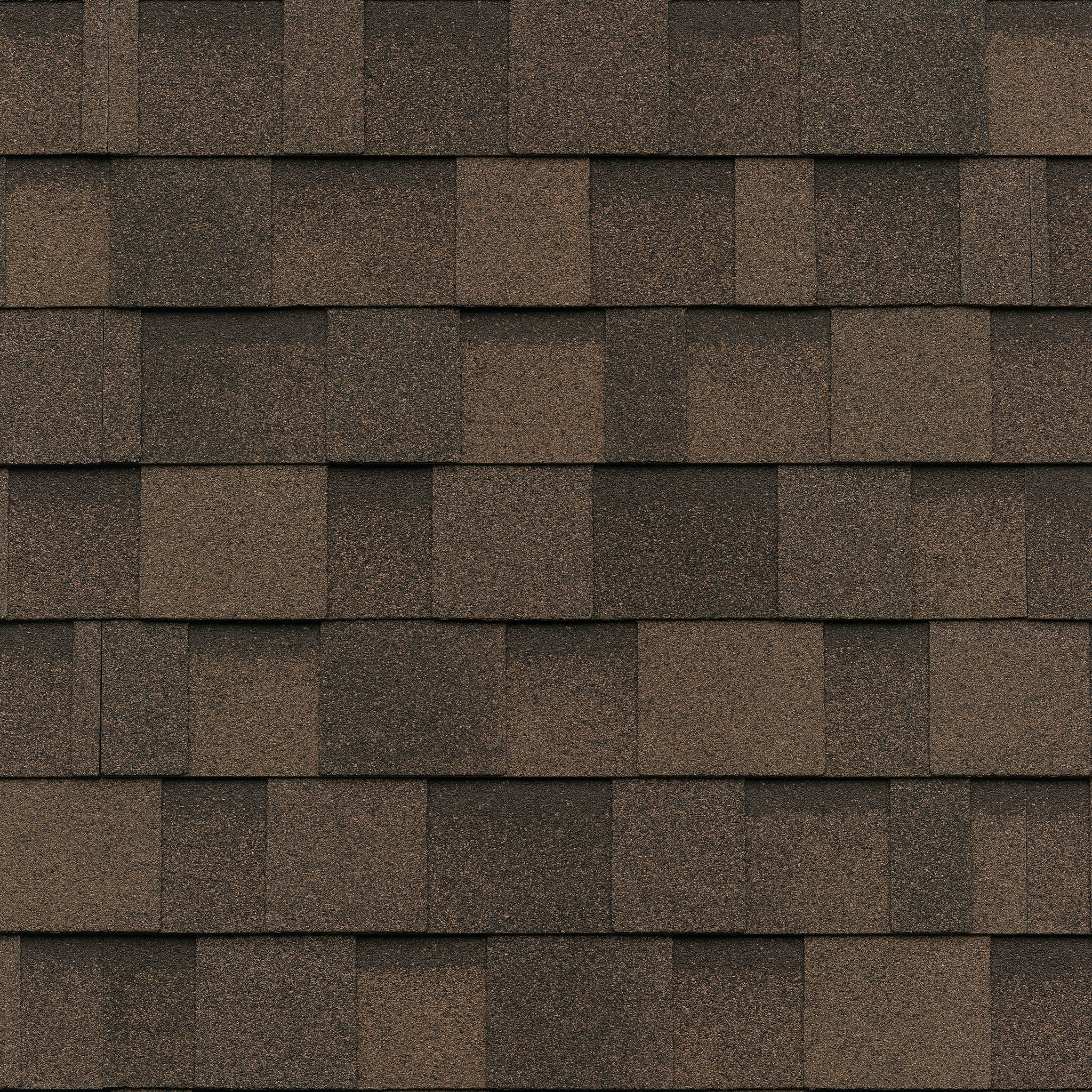 Close-up of a Cambridge roof in Dual Brown, highlighting the overlapping rectangular asphalt shingles with a textured surface.