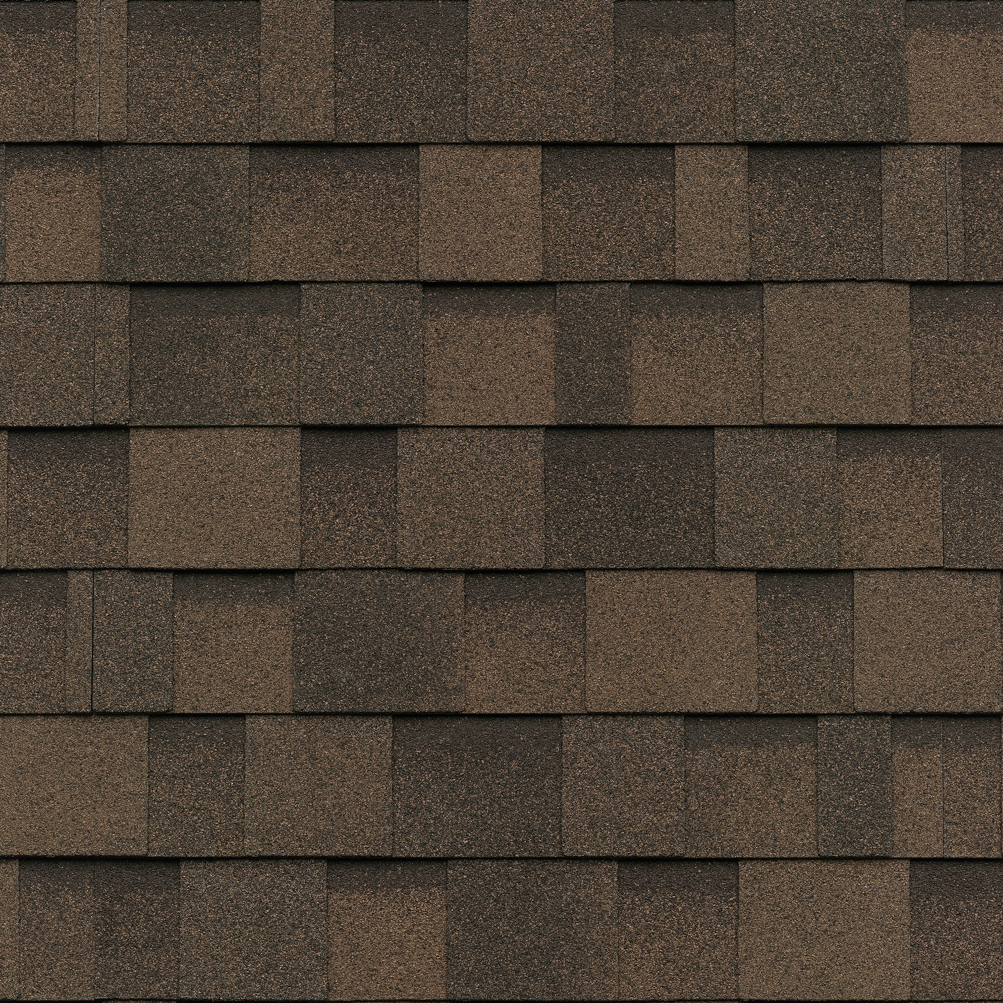 Close-up of a Cambridge roof in Dual Brown, highlighting the overlapping rectangular asphalt shingles with a textured surface.