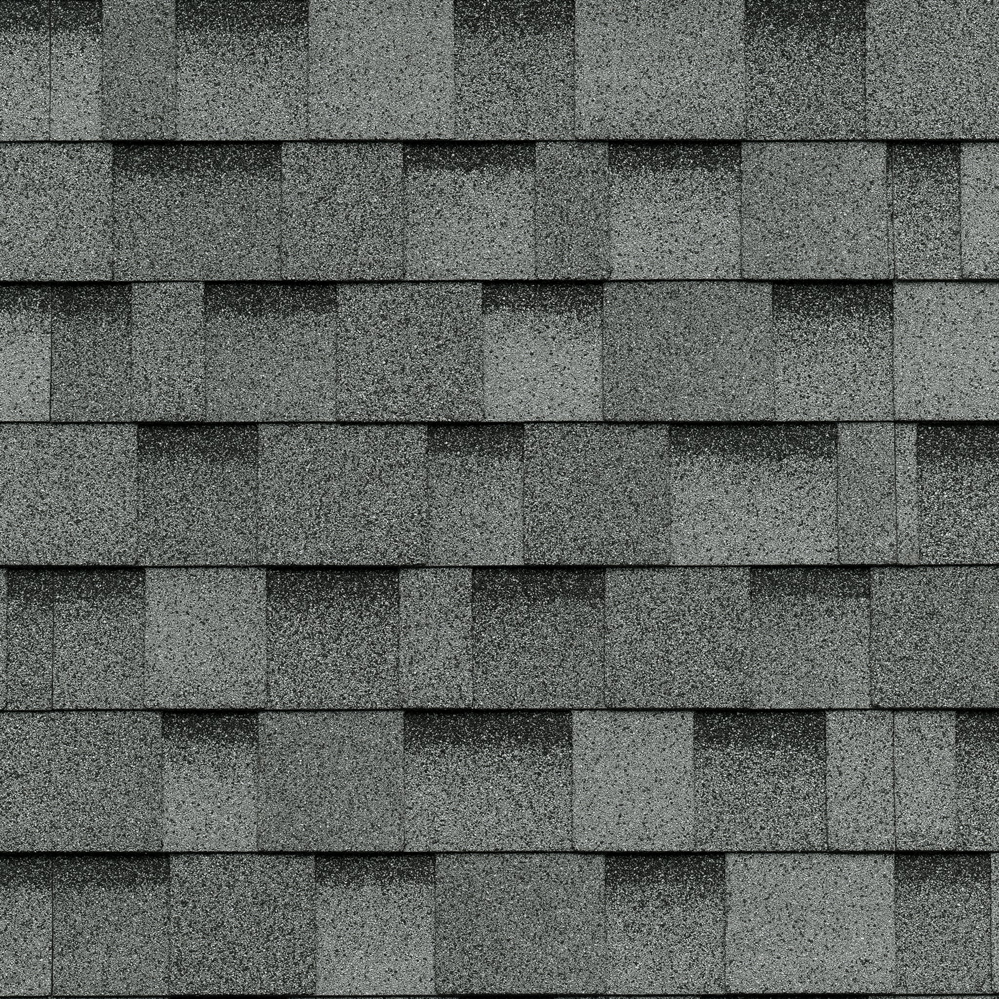 Close-up view of a roof with Dual Grey asphalt shingles, elegantly arranged in a layered pattern, showcasing the Cambridge Cool Colors palette.