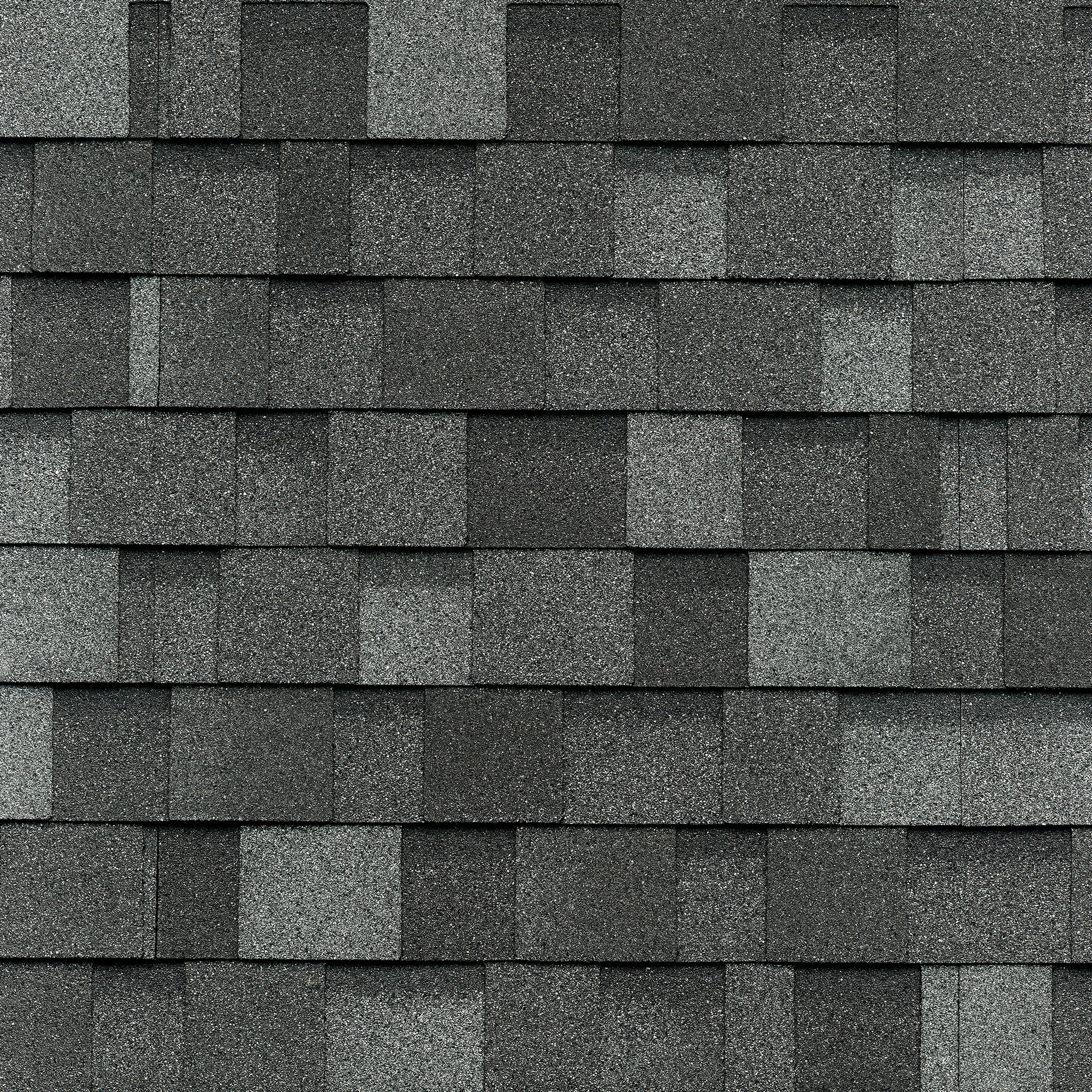 Close-up of a Cambridge-style dark gray asphalt shingle roof, resembling classic slate with its uniform, rectangular pattern and textured surface.