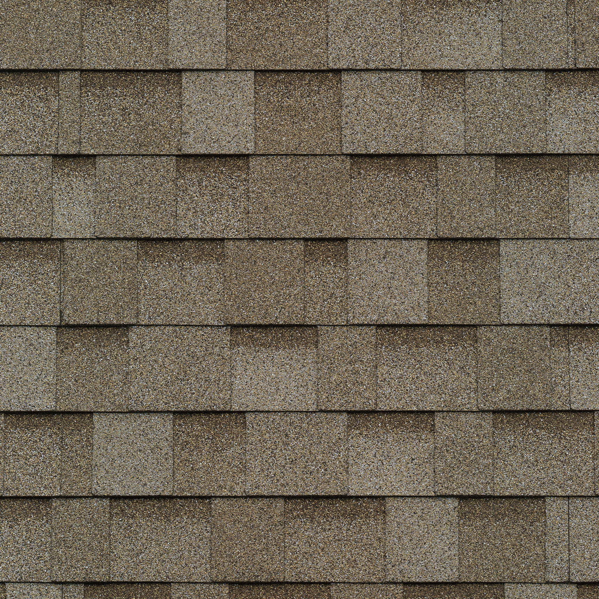 Close-up of overlapping brown asphalt shingles on a roof, showcasing a textured, rectangular pattern reminiscent of Cambridge architecture.