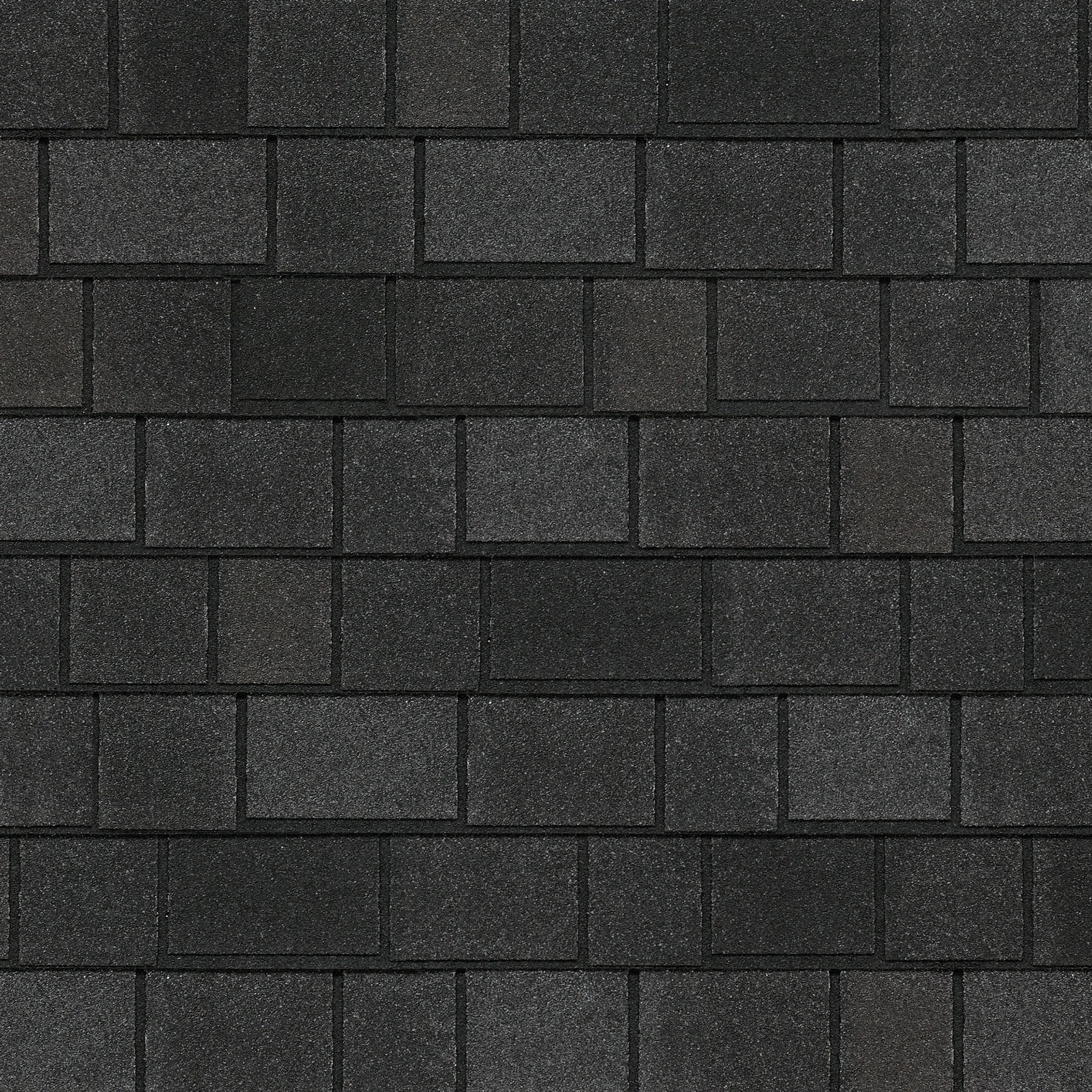 A close-up view of an asphalt shingle roof showcases the Royal Estate's elegant design, featuring rectangular, textured dark gray shingles in a staggered pattern reminiscent of Shadow Slate.