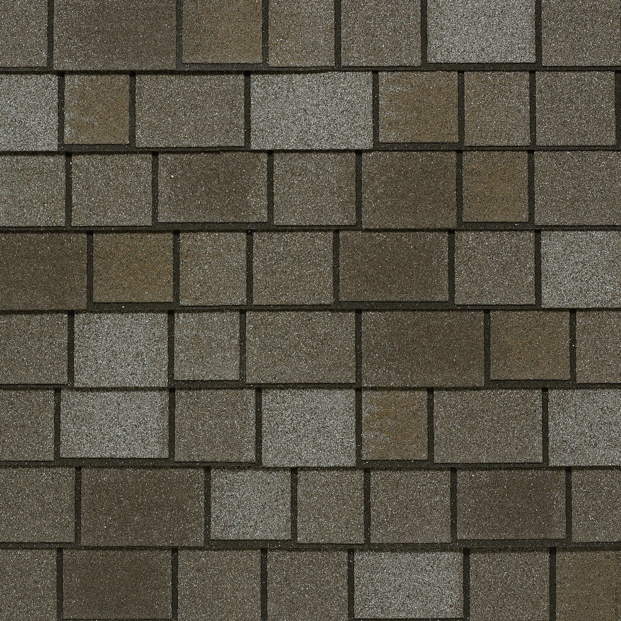 Close-up of a textured roof with alternating dark and taupe slate rectangular shingles in a grid pattern, reminiscent of a Royal Estate.