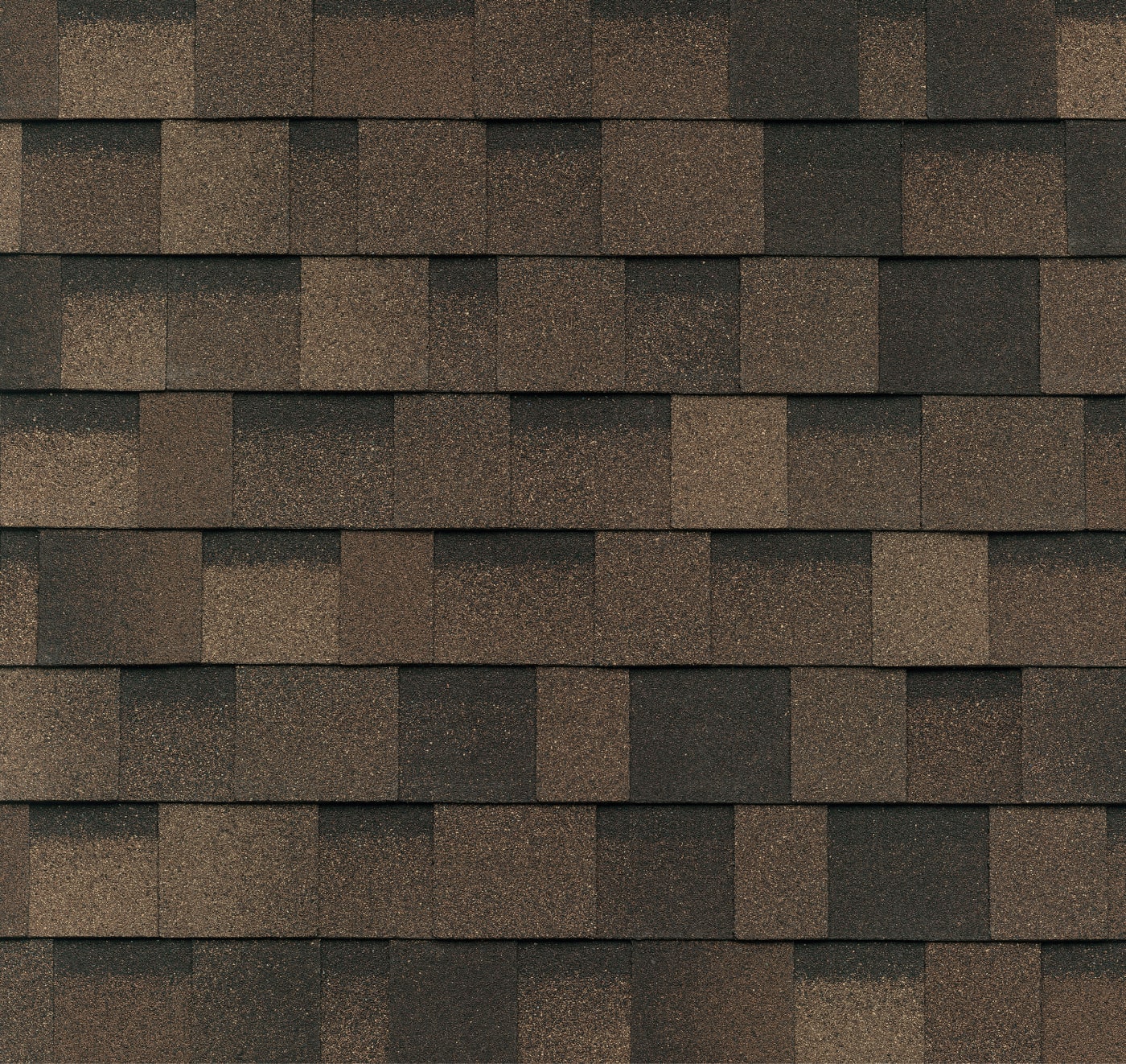 Close-up of overlapping brownstone asphalt roof shingles, arranged in a uniform pattern reminiscent of a dynasty's enduring craftsmanship.