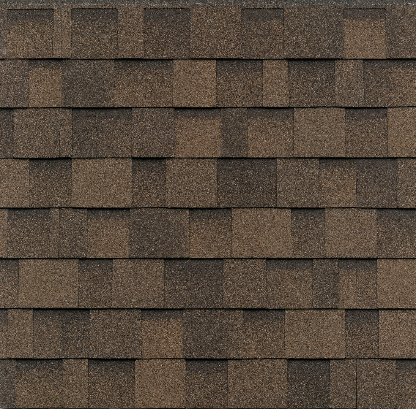 The Dynasty Cool Plus Dual Brown asphalt roofing shingles feature a rectangular, patterned layout.