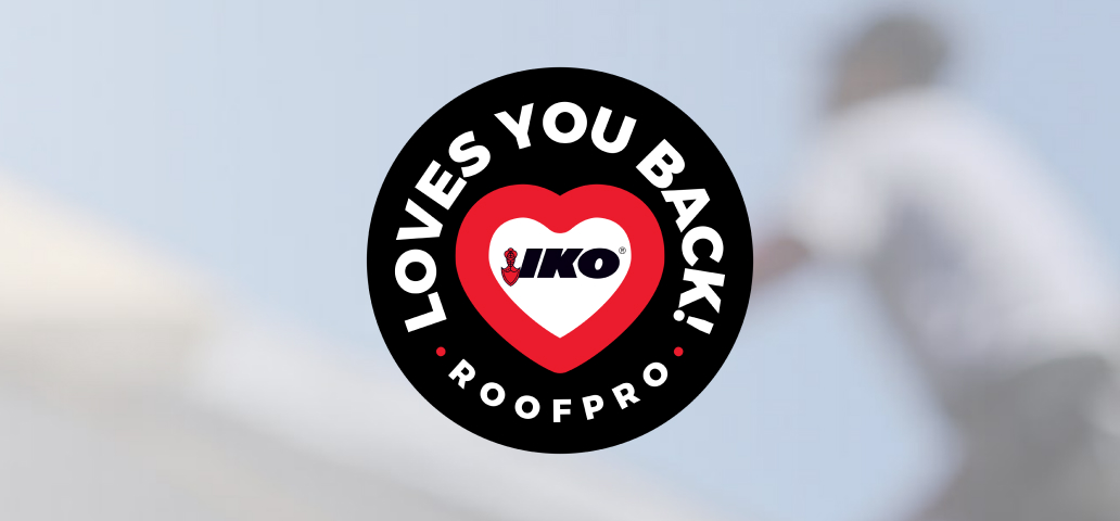 Circular logo with "Loves You Back! ROOFPRO" text around a heart, featuring the IKO brand logo in the center. Blurred background with a person, focusing on logo.