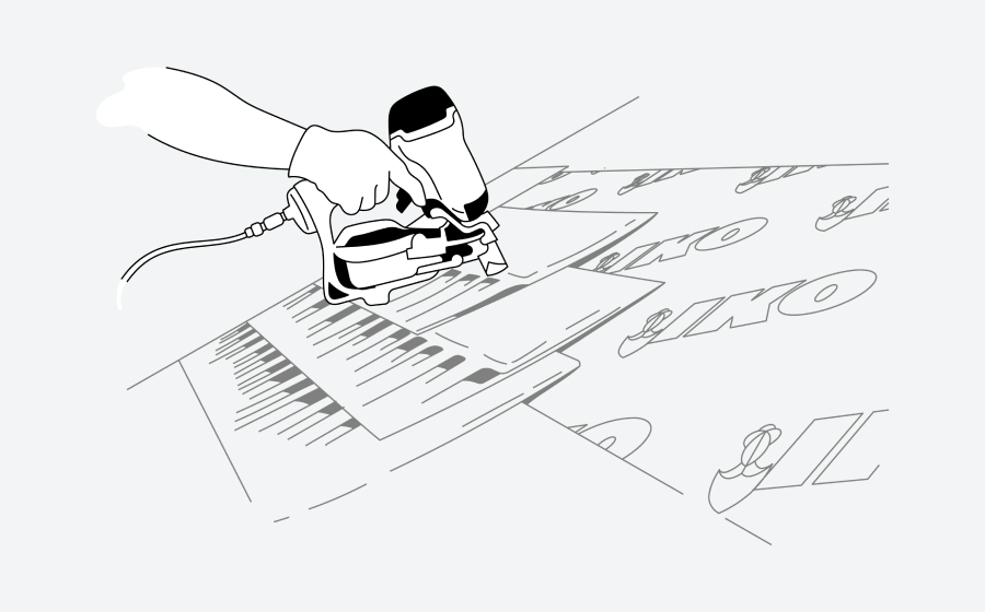 Illustration of hands operating an electric sander on a wooden surface with letters and arrows on paper.