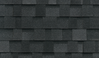 Close-up of dark gray asphalt shingles arranged in a uniform pattern, reminiscent of granite, showcasing the texture and design of a typical roof surface.