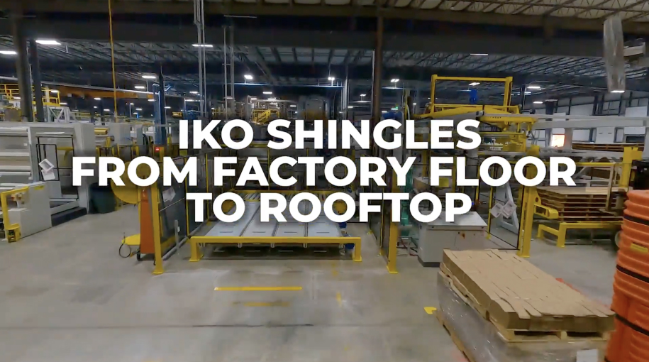 Interior of a bustling factory with machinery and neatly stacked materials. The text overlay proudly declares, "IKO Shingles: From Factory Floor to Rooftop.