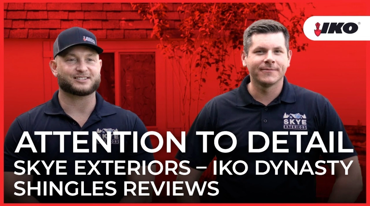 Two men in matching Skye Exteriors shirts stand proudly before a building. Text overlay reads: "Attention to Detail: Skye Exteriors – Celebrated IKO Dynasty Shingles Reviews." An IKO logo is prominently featured on the top right.