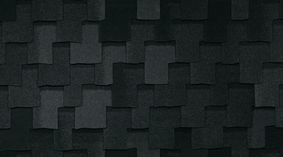 Close-up of overlapping dark gray Armourshake shingles in Shadow Black, creating a textured pattern.