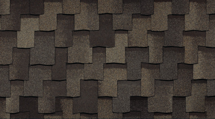 Close-up of overlapping Armourshake shingles on a roof, showcasing a pattern of rectangular shapes. The rich, brown tones create an appealing contrast that mimics the texture of weathered stone for a sophisticated finish.