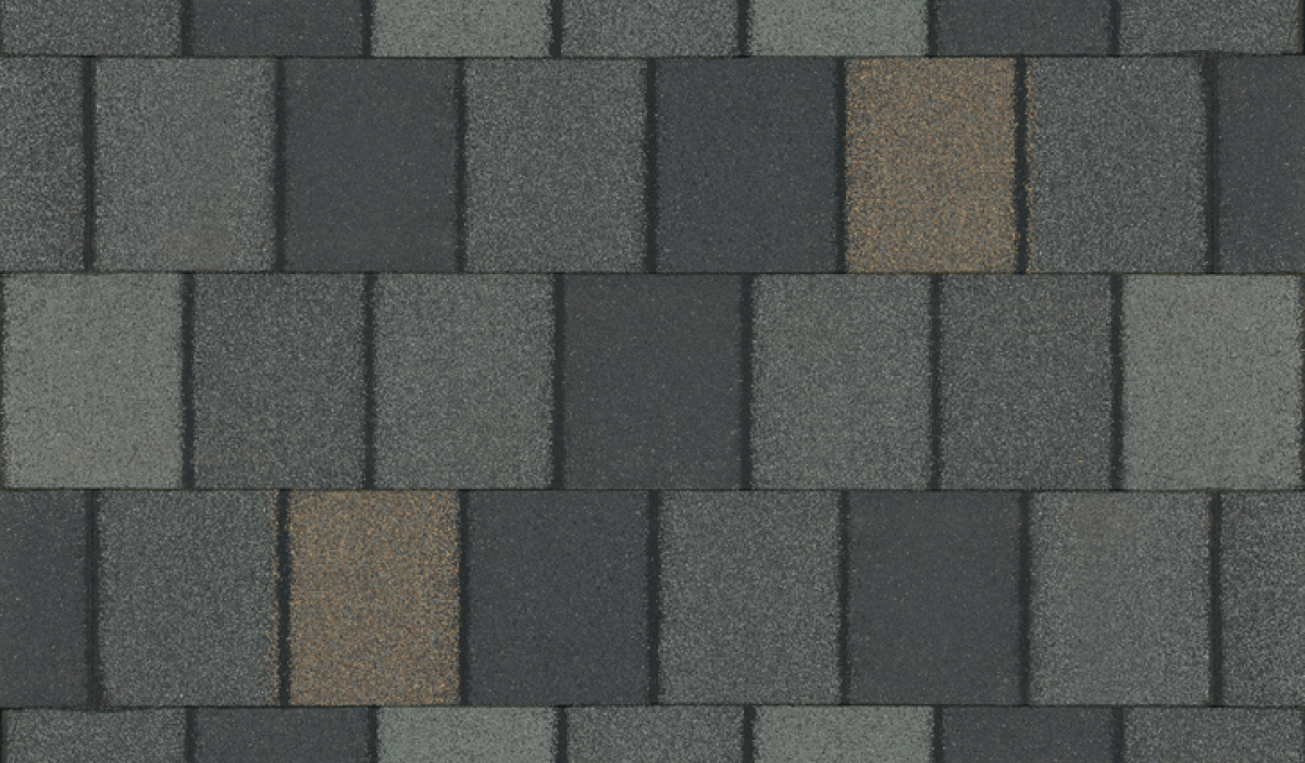 Close-up of a Crowne Slate asphalt shingle roof pattern with a single brown shingle, featuring a regal, grid-like arrangement.