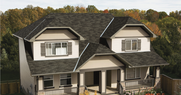 This charming two-story house features a dark roof and beige siding, complemented by a front porch perfect for relaxing after a Marathon run. It’s nestled behind a wooden fence, with trees providing a scenic backdrop on a clear day.