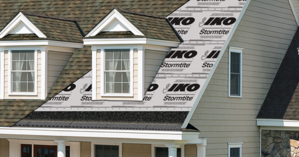 A large roofing shingle is digitally superimposed over a house, showcasing Leading Edge Plus™ roofing installation. A ladder is propped against the house.