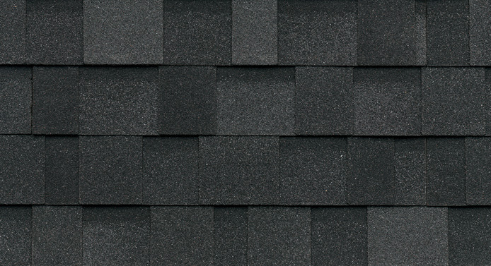 Close-up of Granite Black asphalt roof shingles arranged in a neat, Nordic-inspired pattern.