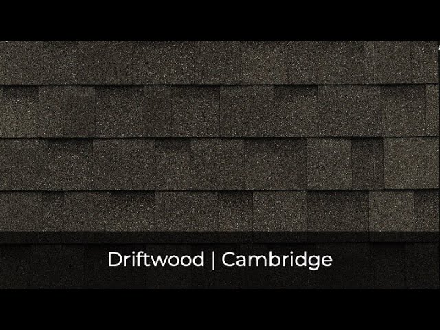 Close-up of dark gray asphalt roof shingles with the rich texture of IKO Roof Shingle Colors, showcasing the elegance of Driftwood. Text at the bottom: "Driftwood | Cambridge.